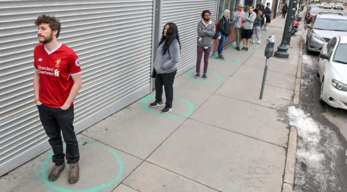 U.S. Prepares for Prolonged Shutdowns as Coronavirus Strains Hospitals